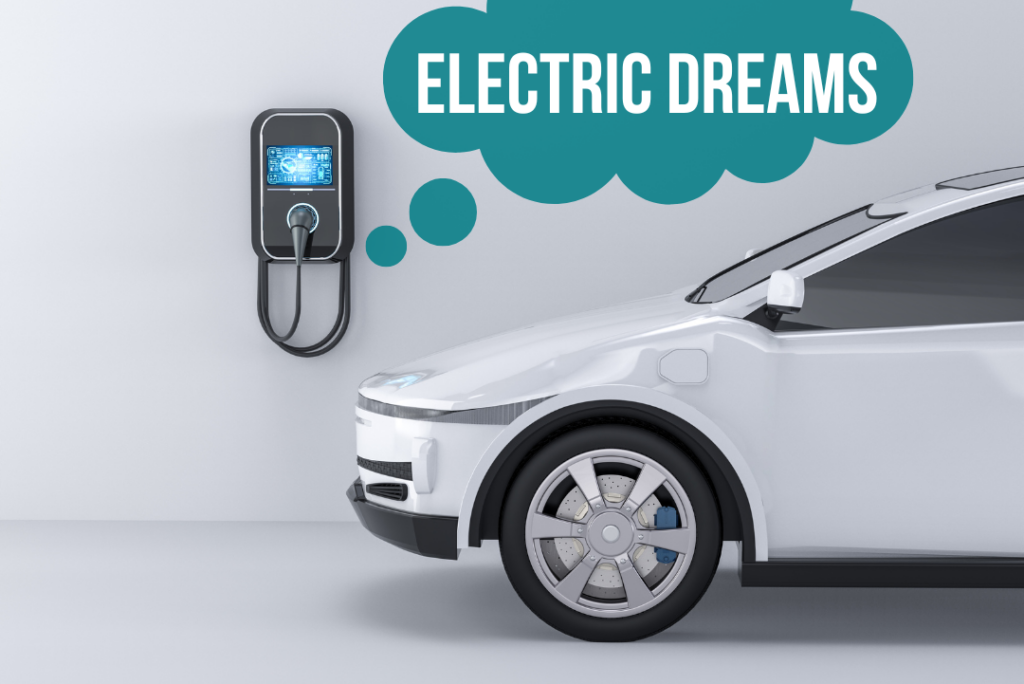 Electric Dreams text in a thought bubble, electric vehicle charger, front of a white electric vehicle