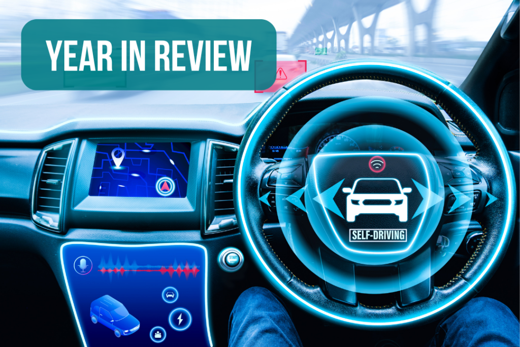 Year in Review featured image with a steering wheel and electric components of a vehicle.