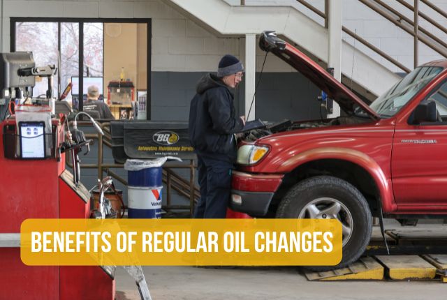 Image of Houska Automotive staff under the hood of a car. Text over photo say Benefits of Regular Oil Changes.
