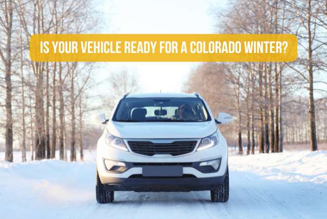 The front view of a car on a road with snow and a bare tree background featuring the title, 'Is Your Vehicle Ready for a Colorado Winter?'