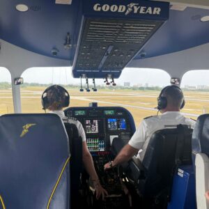 Houska Management team in the Goodyear Blimp