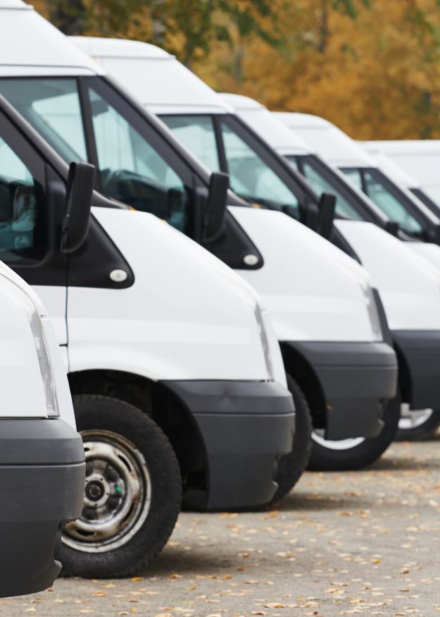 the front view of sprinter busses lined up together